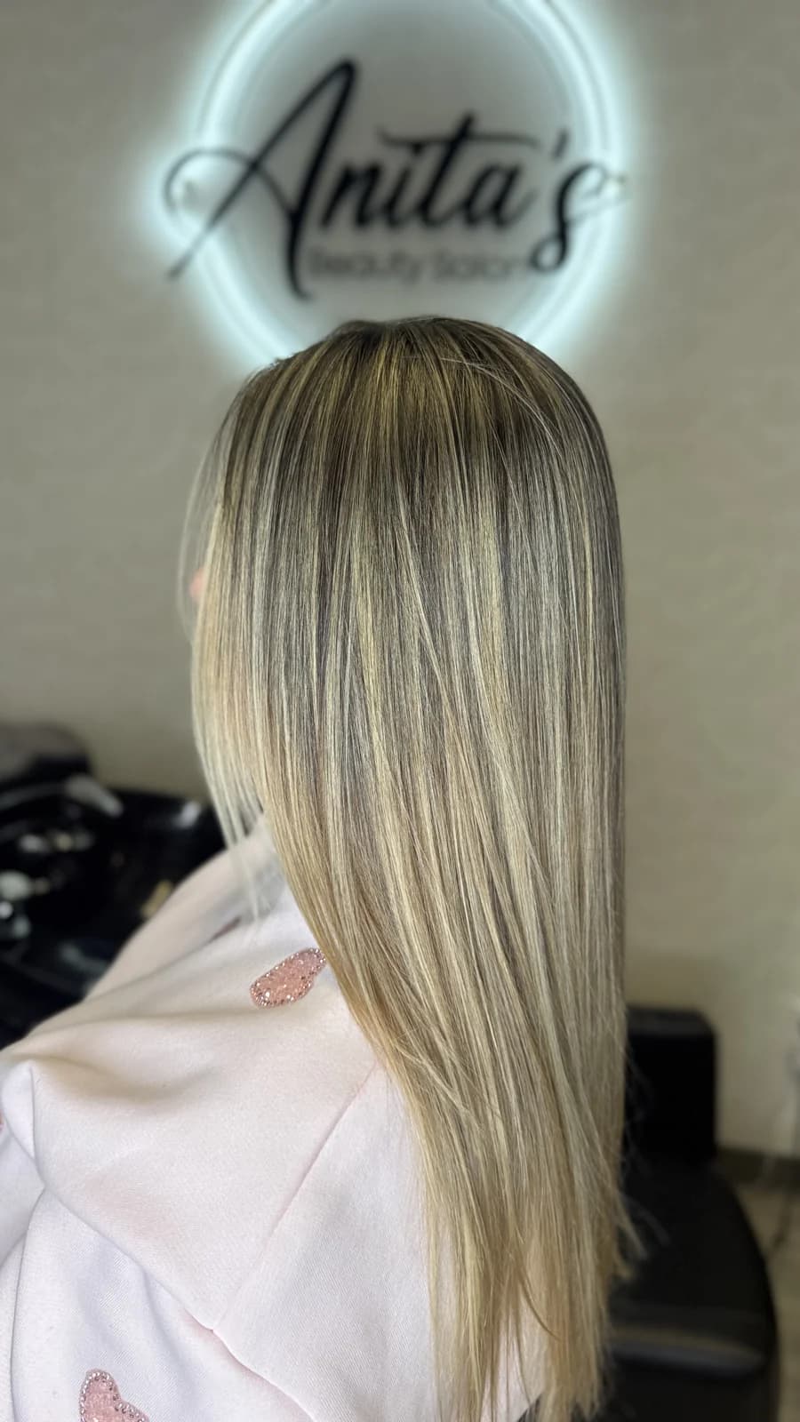 Long straight blonde hair with balayage at Anita's Beauty, Germantown TN